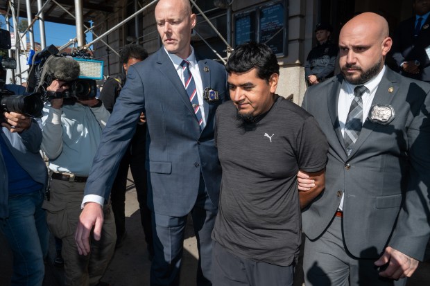 Rogelio Lozano Garita is pictured in police custody leaving the NYPD's 101st Precinct stationhouse in Queens on Tuesday, Oct. 27, 2026. Lozano Garita is accused of killing Seraphina Pereira, who was found decomposing in Rockaway Community Park near Beach 58th St. and Almeda Ave. in the Rockaways. (Barry Williams/ New York Daily News)
