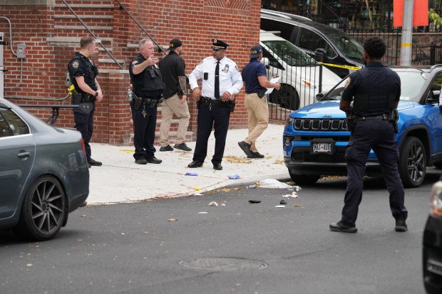 Police investigate on Rochambeau Ave. near E. 206th St. in the Bronx after an off-duty NYPD detective was stabbed and wounded during an attempted robbery near his car parked car on Friday, Oct. 2, 2026. (Barry Williams / New York Daily News)