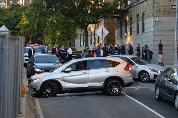 Law enforcement officers investigate after ICE agents shot and wounded a man on Marble Hill Ave. near W. 225th St. in the Bronx on Thursday, Oct. 8, 2026. (Barry Williams / New York Daily News)