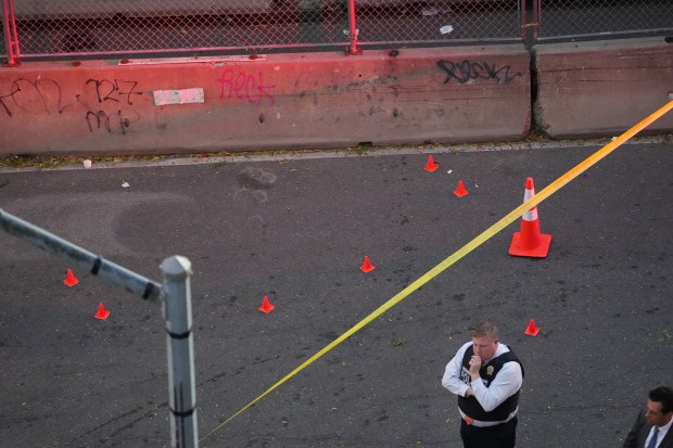 Law enforcement officers investigate after ICE agents shot and wounded a man on Marble Hill Ave. near W. 225th St. in the Bronx on Thursday, Oct. 8, 2026. (Barry Williams / New York Daily News)