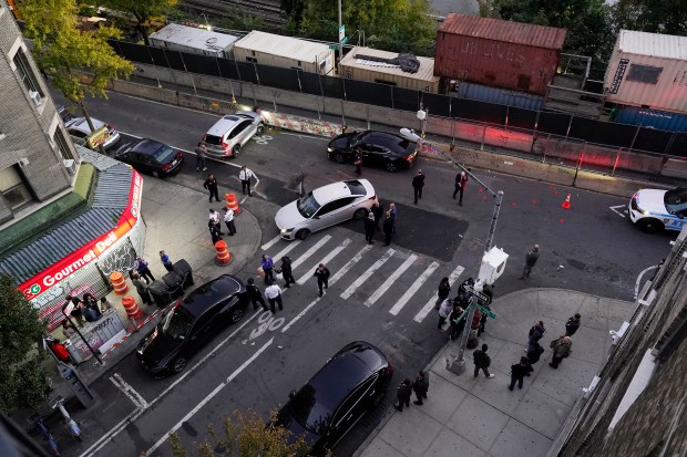 Law enforcement officers investigate after ICE agents shot and wounded a man on Marble Hill Ave. near W. 225th St. in the Bronx on Thursday, Oct. 8, 2026. (Barry Williams / New York Daily News)