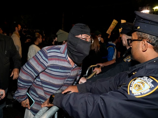 Protesters clash with law enforcement officers after ICE agents shot and wounded a man on Marble Hill Ave. near W. 225th St. in the Bronx on Thursday, Oct. 8, 2026. (Barry Williams / New York Daily News)