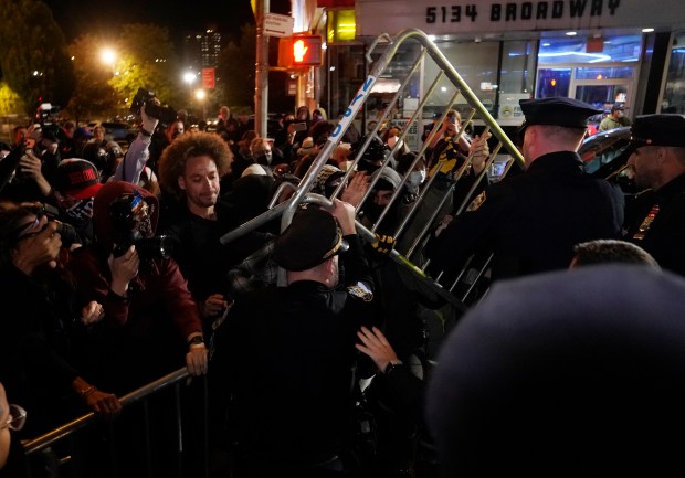 Protesters clash with law enforcement officers after ICE agents shot and wounded a man on Marble Hill Ave. near W. 225th St. in the Bronx on Thursday, Oct. 8, 2026. (Barry Williams / New York Daily News)