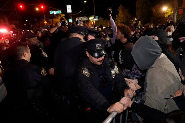 Protesters clash with law enforcement officers after ICE agents shot and wounded a man on Marble Hill Ave. near W. 225th St. in the Bronx on Thursday, Oct. 8, 2026. (Barry Williams / New York Daily News)