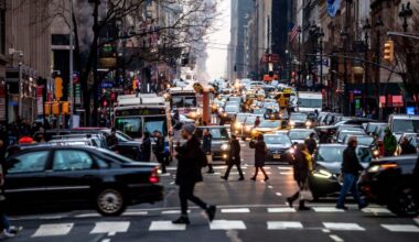 Pedestrians making their way through traffic in midtown nyc