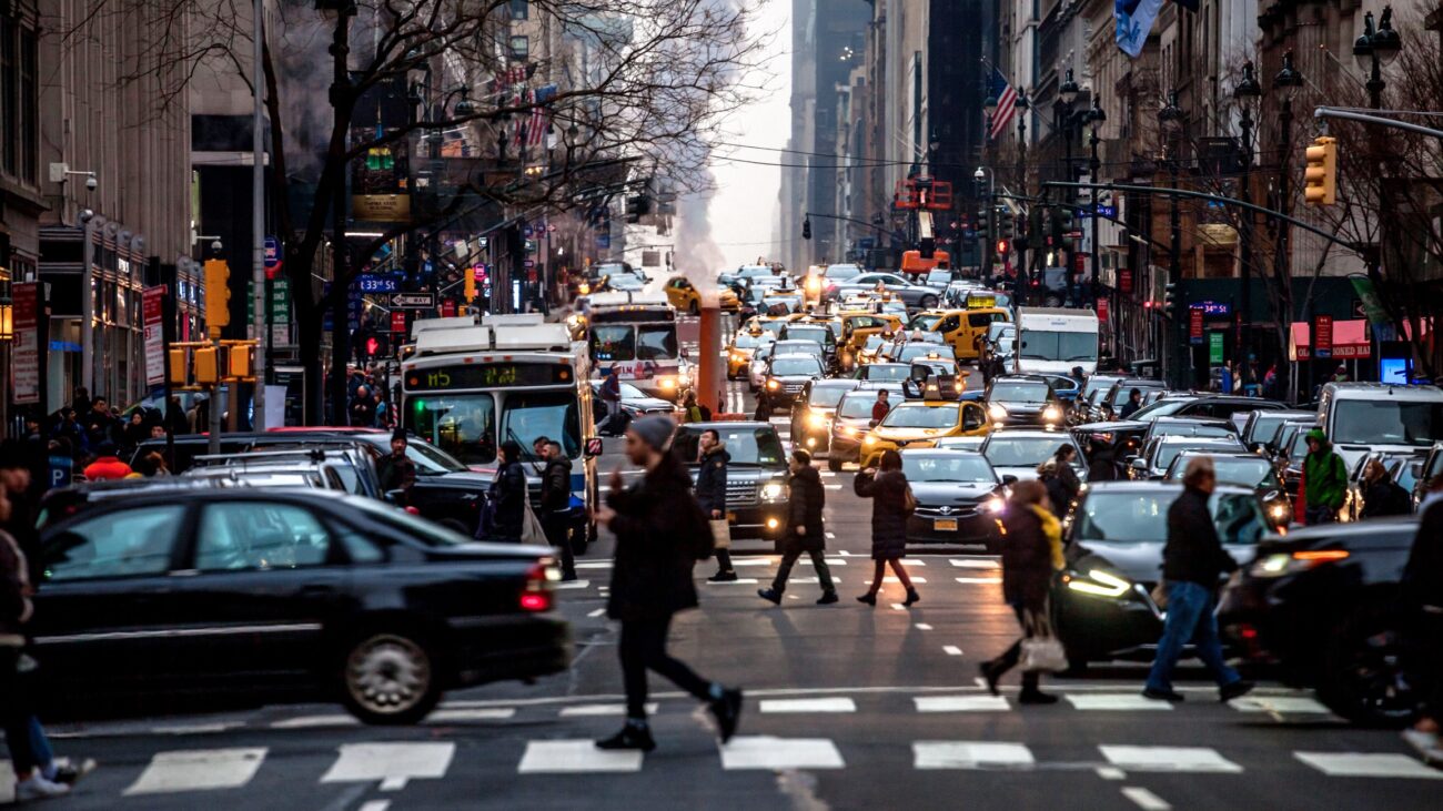 Pedestrians making their way through traffic in midtown nyc