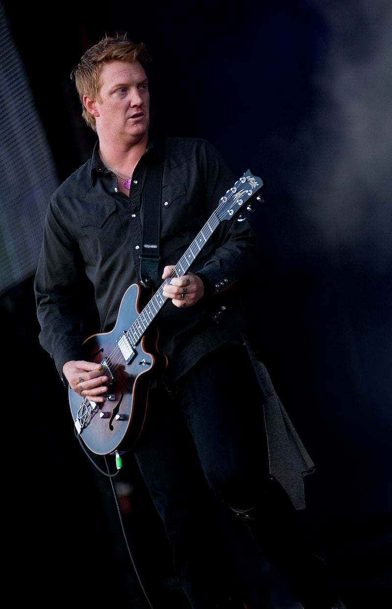 Josh Homme of Queens of the Stone Age, live on stage at Reading Festival on August 27, 2010.