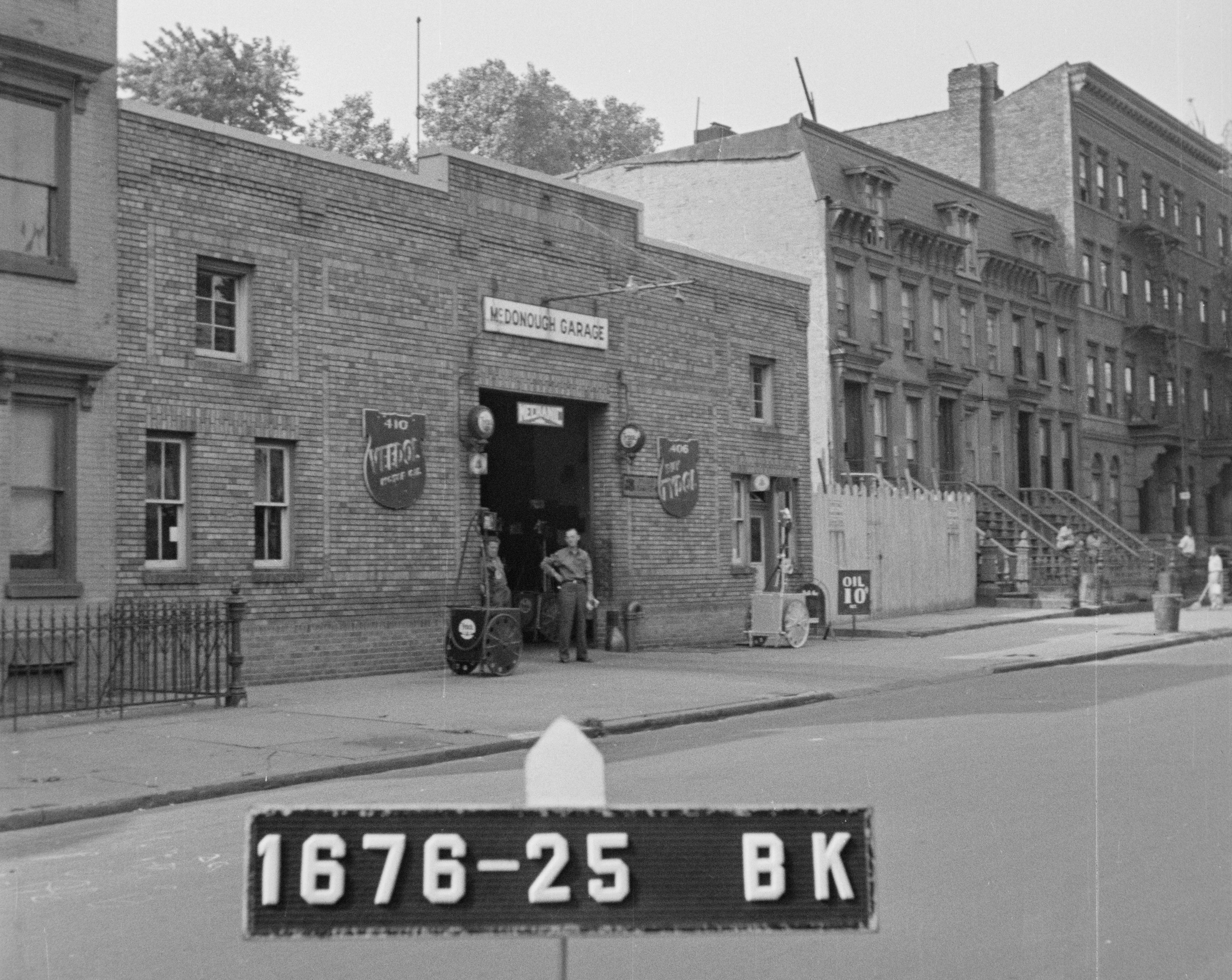 black and white photo of a brick garage