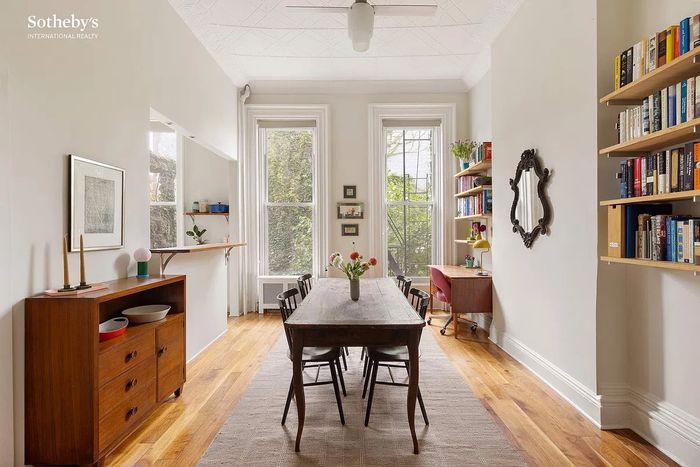 As seen in this listing photo, this one-bedroom in a Carroll Gardens brownstone feels particularly airy thanks to the nearly 12-foot-high tin ceilings.