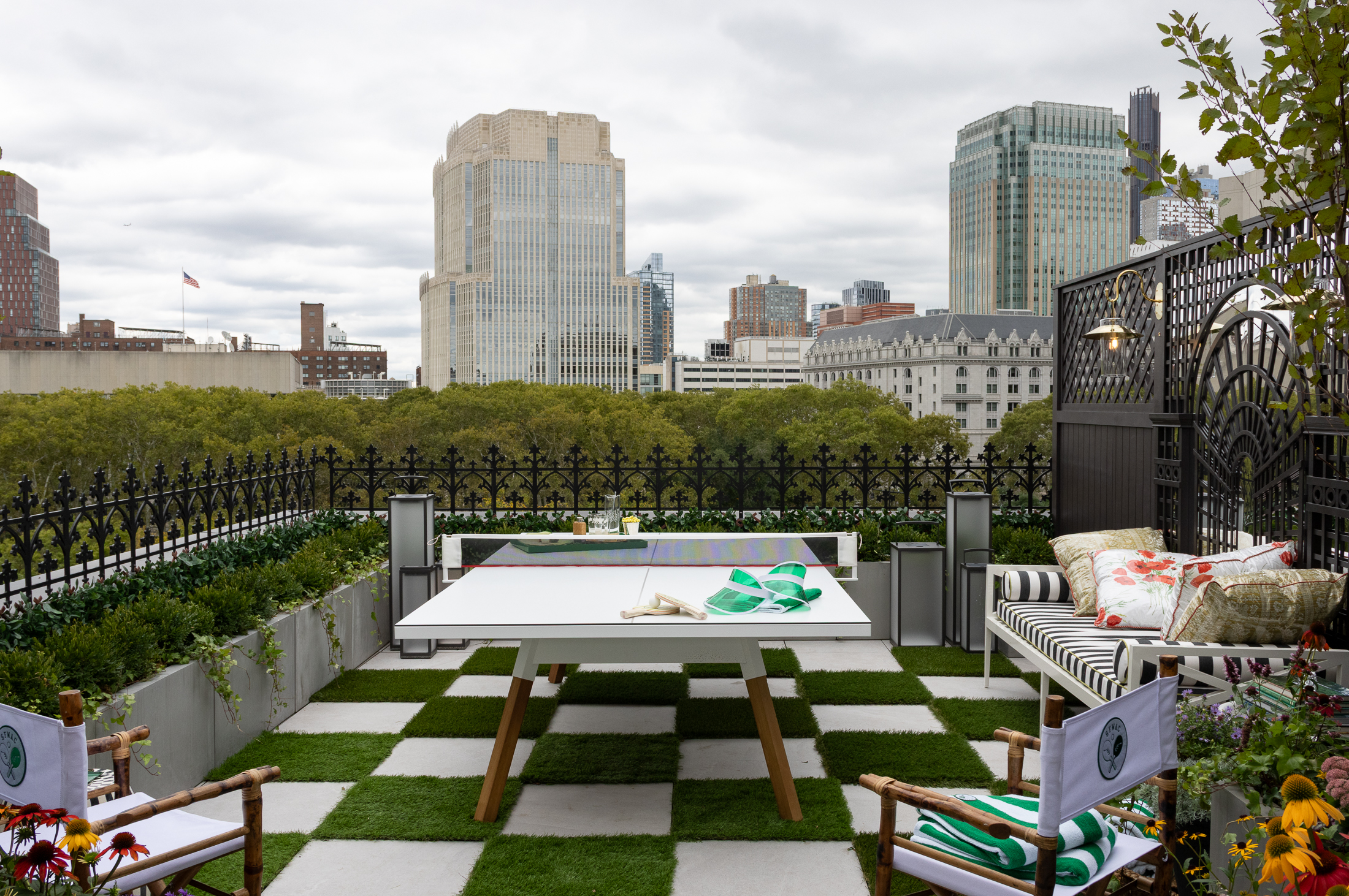 rooftop with checkerboard grass and paver flooring