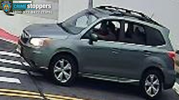 Police released surveillance video images of a man and a woman who they said stole a 10-year-old Yorkshire terrier from a home in College Point, Queens on Sept. 17, 2026. They fled in this 2014 Subaru Forester, authorities said. (NYPD)