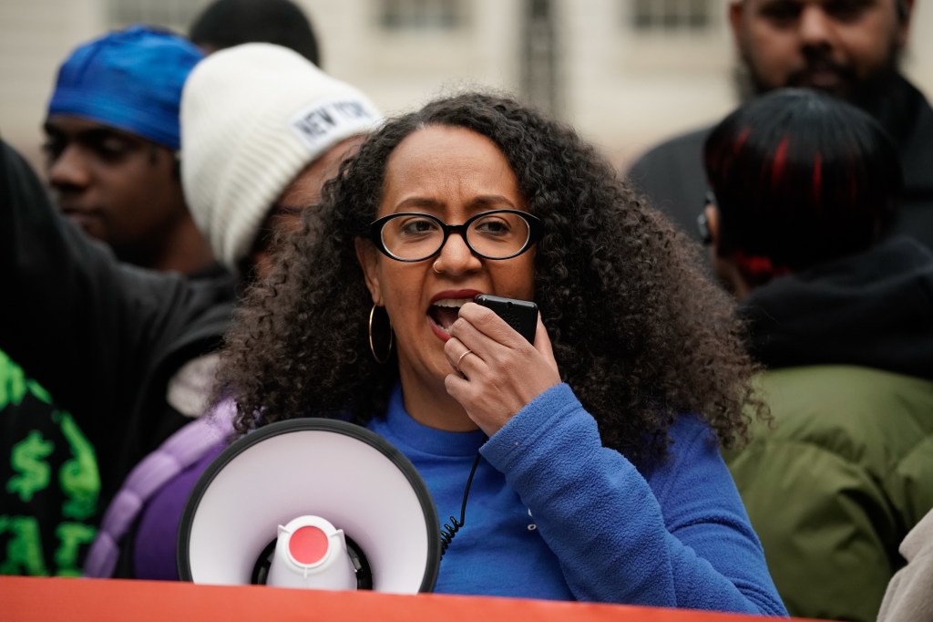 Chair and Executive Director of the NYC Commission on Racial Equity Linda Tigani speaks into a microphone during a rally in New York City.