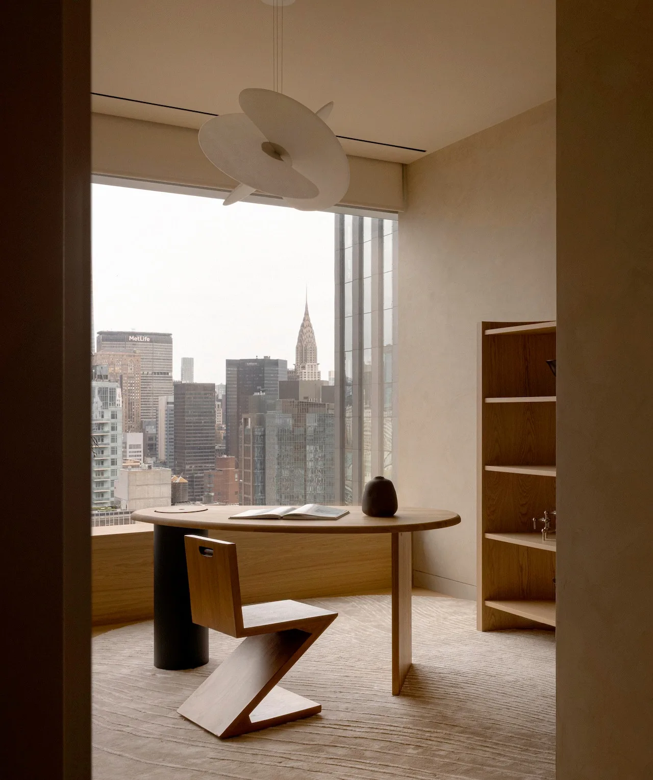 Modern minimalist hallway featuring wooden flooring and ambient lighting.