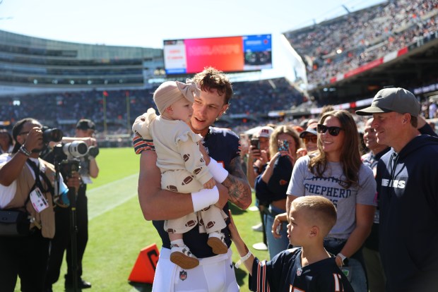 Bears quarterback Tyson Bagent is with his family before the game against the Jets on Oct. 4, 2026, at Soldier Field in Chicago. (Brian Cassella/Chicago Tribune)