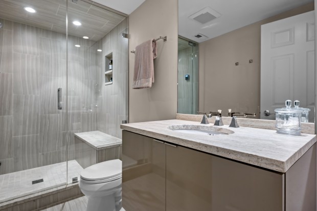 This five-bedroom house at 911 Queens Lane in Glenview has a lower level with a recreation room, an exercise room, a wine cellar, and a bedroom and full bath with steam shower. (Phil Goldman/Summit Imaging)