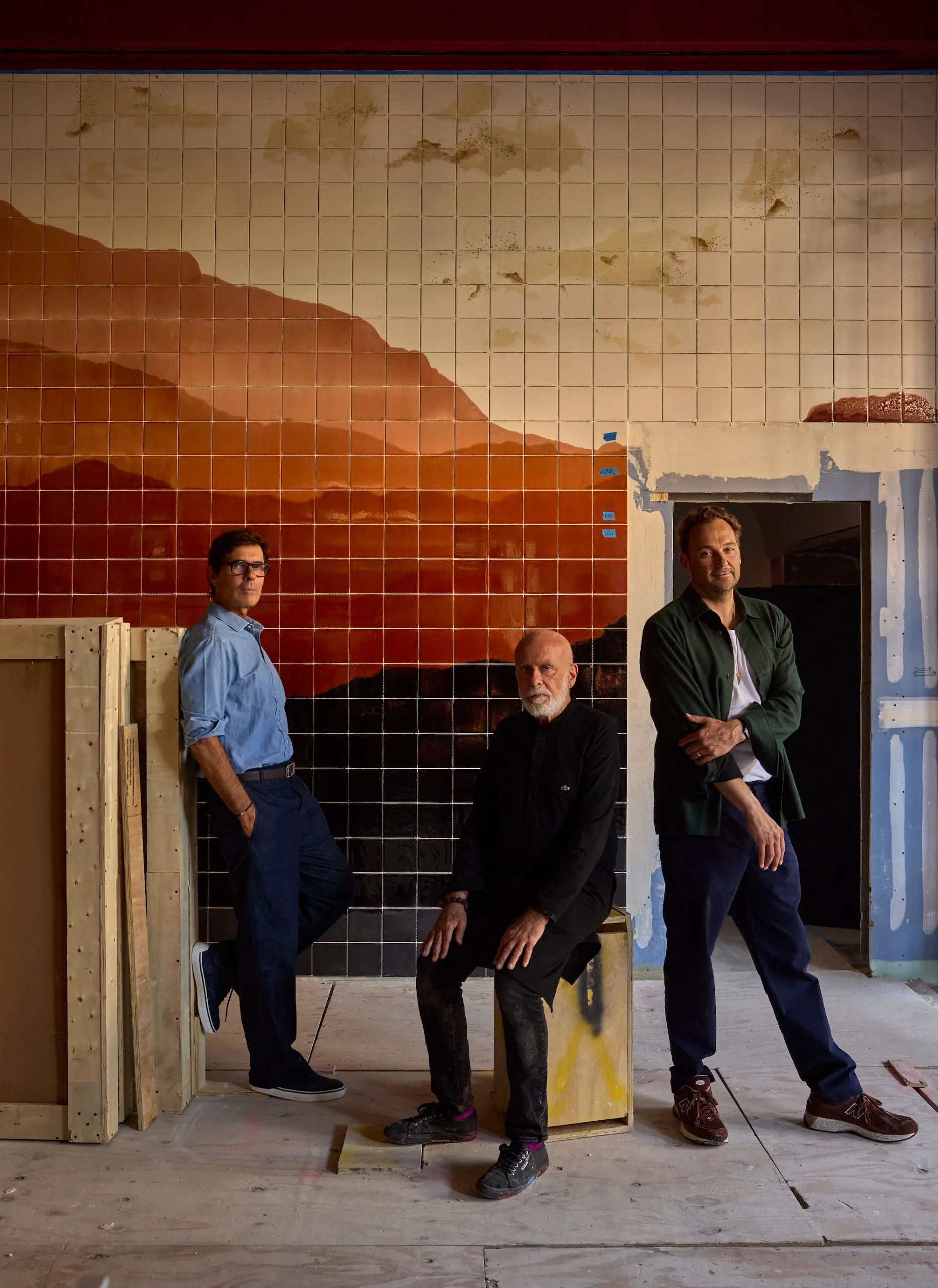 Pierre Yovanovitch, Francesco Clemente, and Daniel Humm posed together smiling.