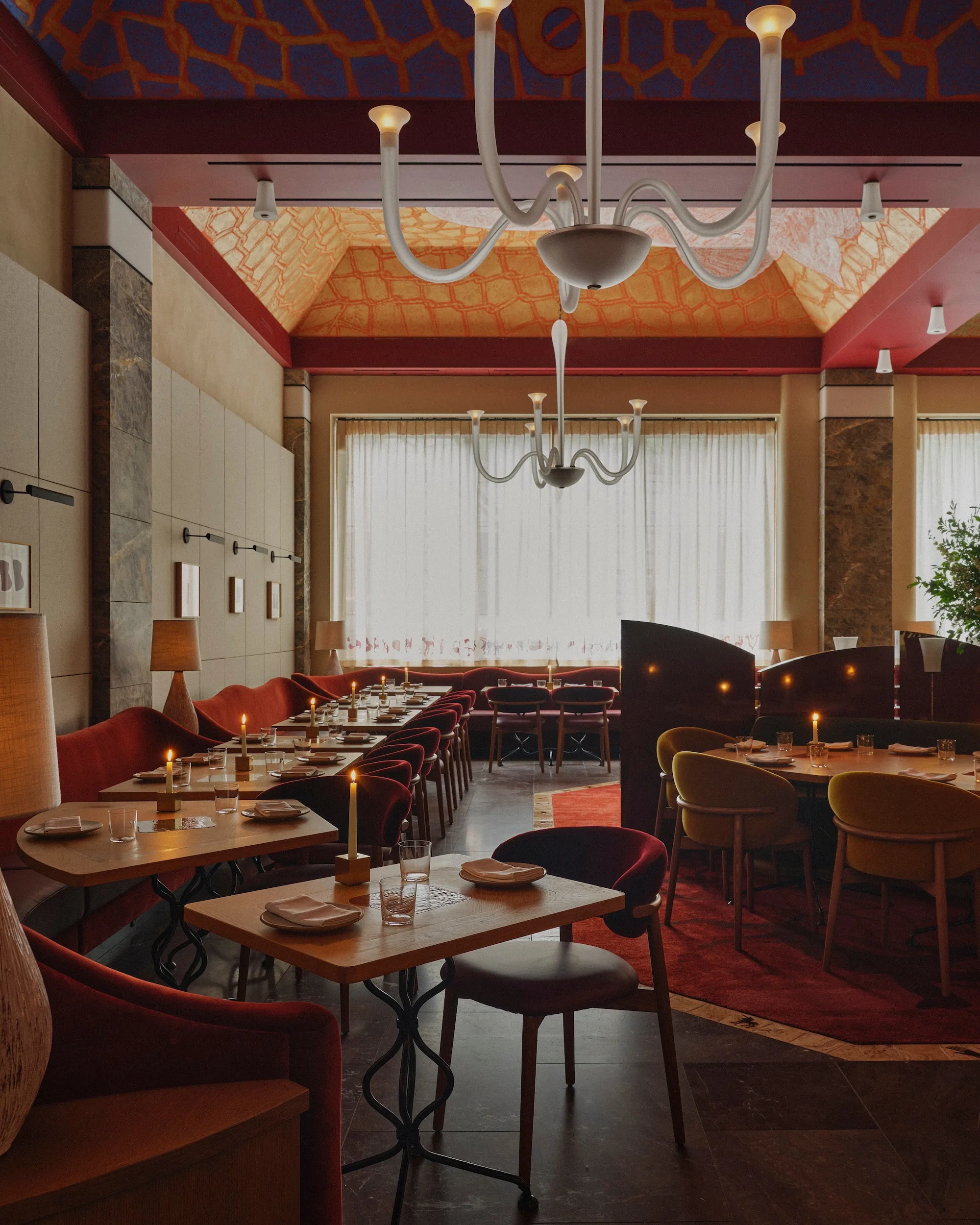 Daniel Humm standing in his New York restaurant's elegant dining room.