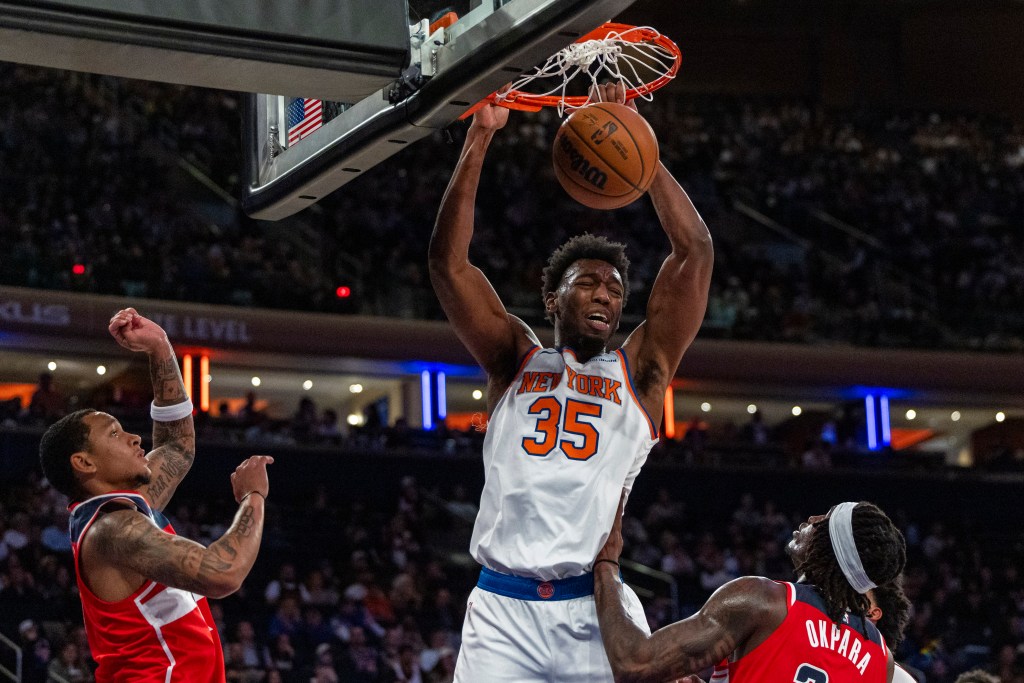 New York Knicks center James Wiseman dunks the ball during a game against the Washington Wizards.