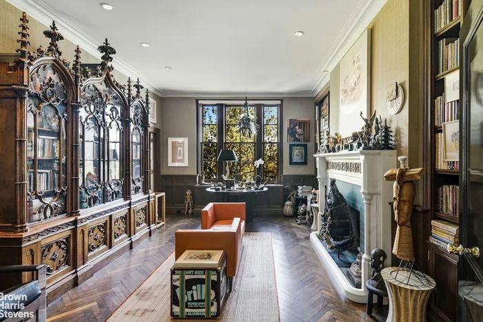 A listing photo shows figures inspired by African art and a cabinet that seems to date to the 19th-century Gothic revival. DeWoody’s tastes are extremely eclectic; she collected Joe Brainard drawings when she began and made smart bets on the work of Amy Sherald, Jeff Koons, and Matthew Wong.