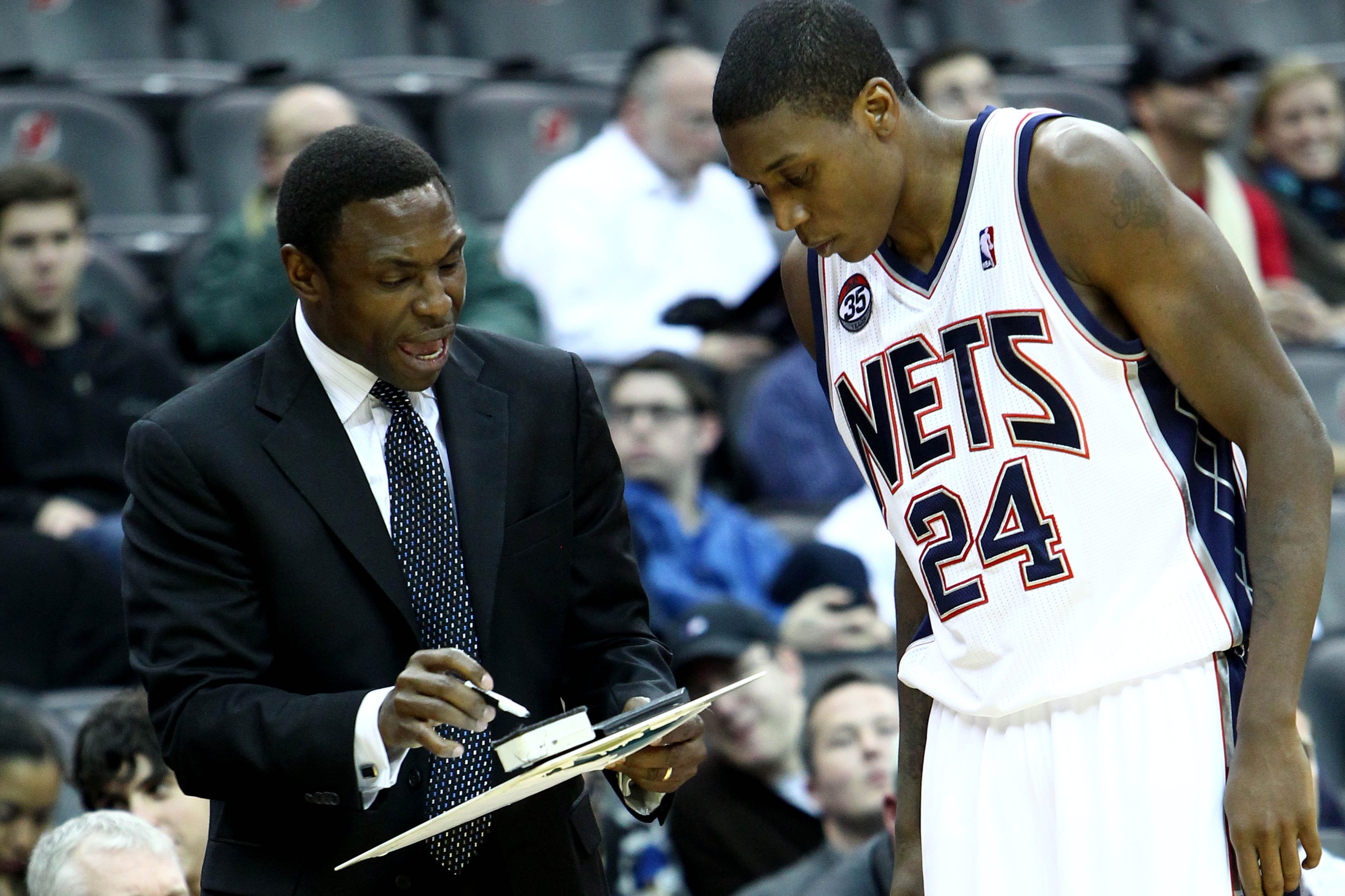 Jan 29, 2012; Newark, NJ, USA; New Jersey Nets head coach Avery Johnson talks to New Jersey Nets forward Larry Owens (24) during the second half against Toronto Raptors at the Prudential Center. Raptors beat the Nets 94-73. Mandatory Credit: Nicole Sweet-USA TODAY Sports