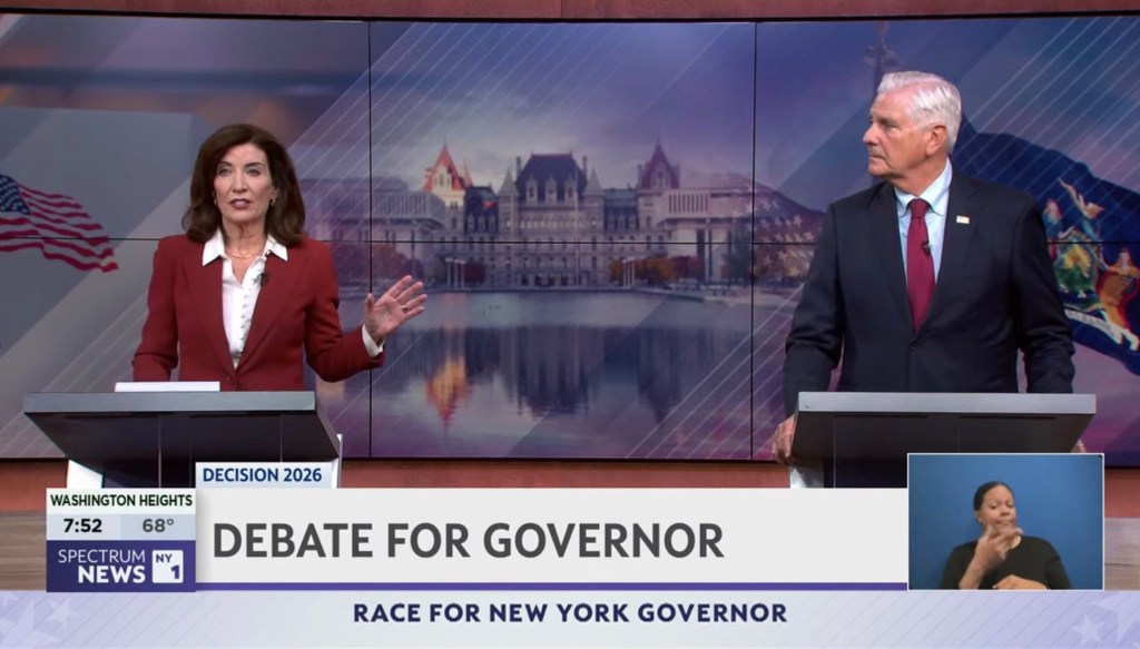 Kathy Hochul and Bruce Blakeman participating in a debate for New York governor.