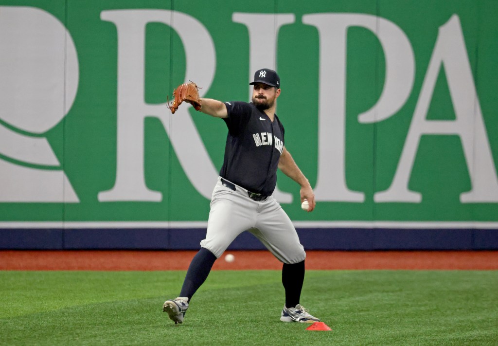 New York Yankees pitcher Carlos Rodón warms up before Game 2 of the ALDS against the Tampa Bay Rays at Tropicana Field.