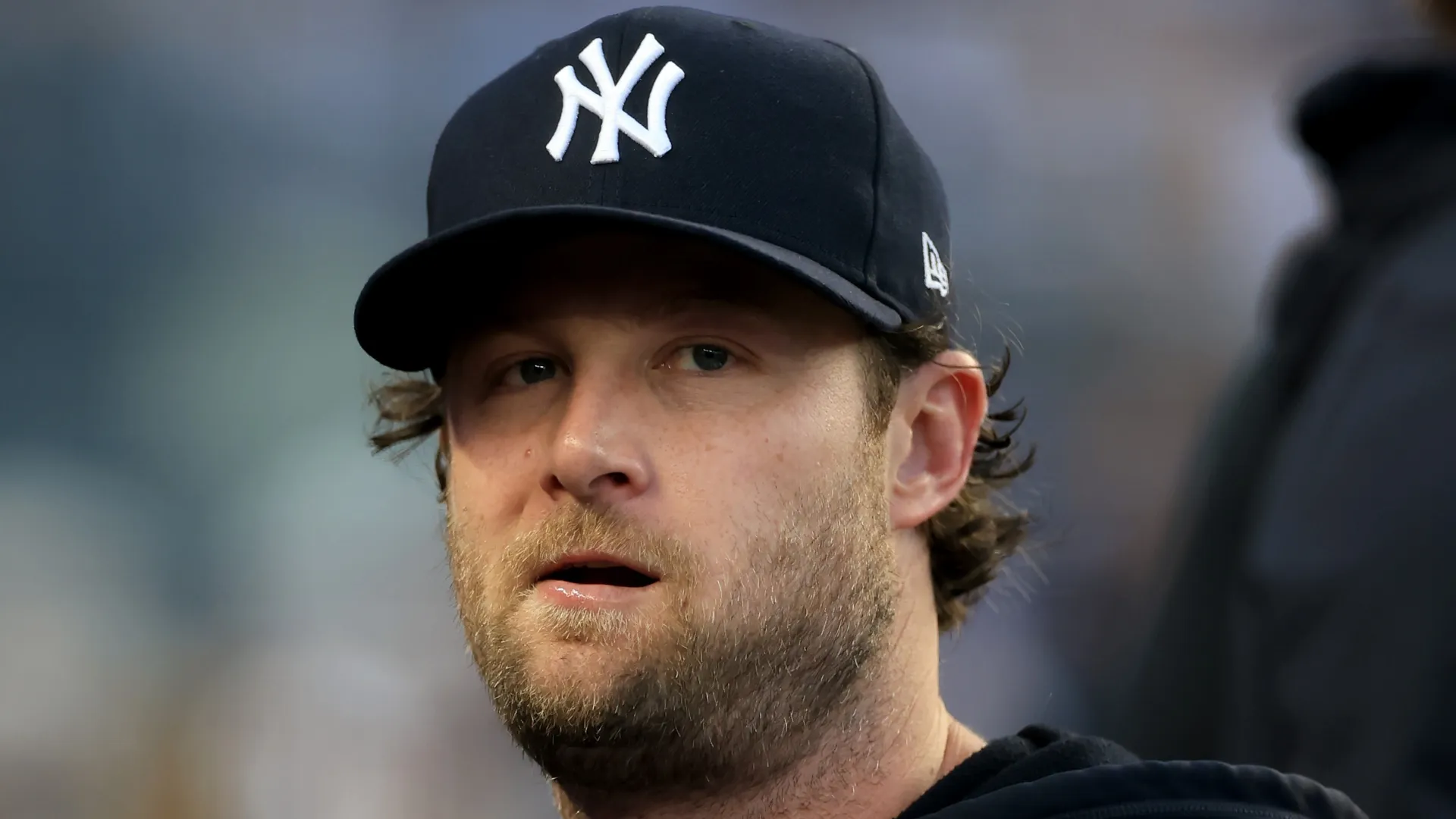 Gerrit Cole #45 of the New York Yankees looks on from the dugout in the second inning against the Toronto Blue Jays at Yankee Stadium on August 21, 2026 in the Bronx borough of New York City.