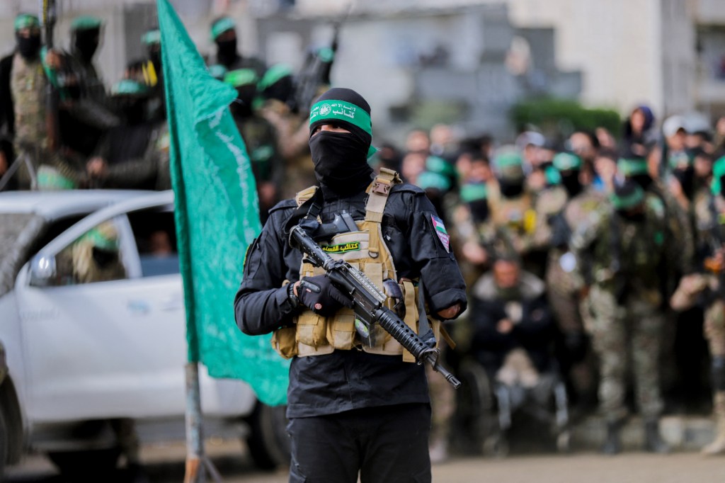 Hamas fighters gather at the Nuseirat refugee camp in the central Gaza Strip.