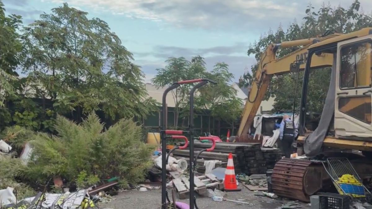 Burned body found in Queens, sources say