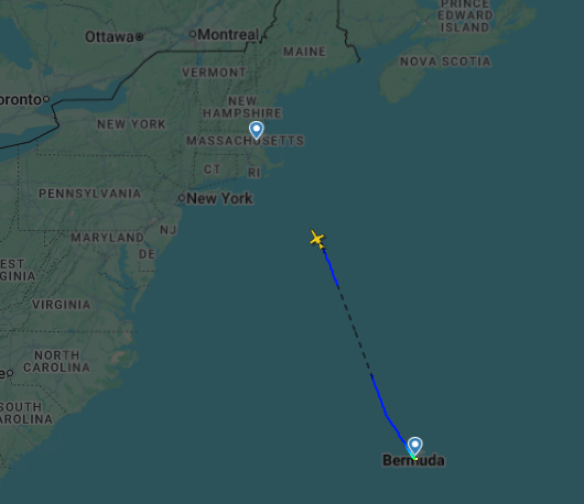 A map of the Atlantic Ocean and eastern North America showing a flight path from Massachusetts to Bermuda, with a plane currently in mid-flight over the ocean.