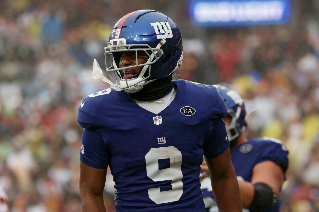 New York Giants' Isaiah Likely celebrates after scoring a touchdown during an NFL football game against the Washington Commanders.