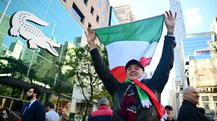 person holding Italian flag