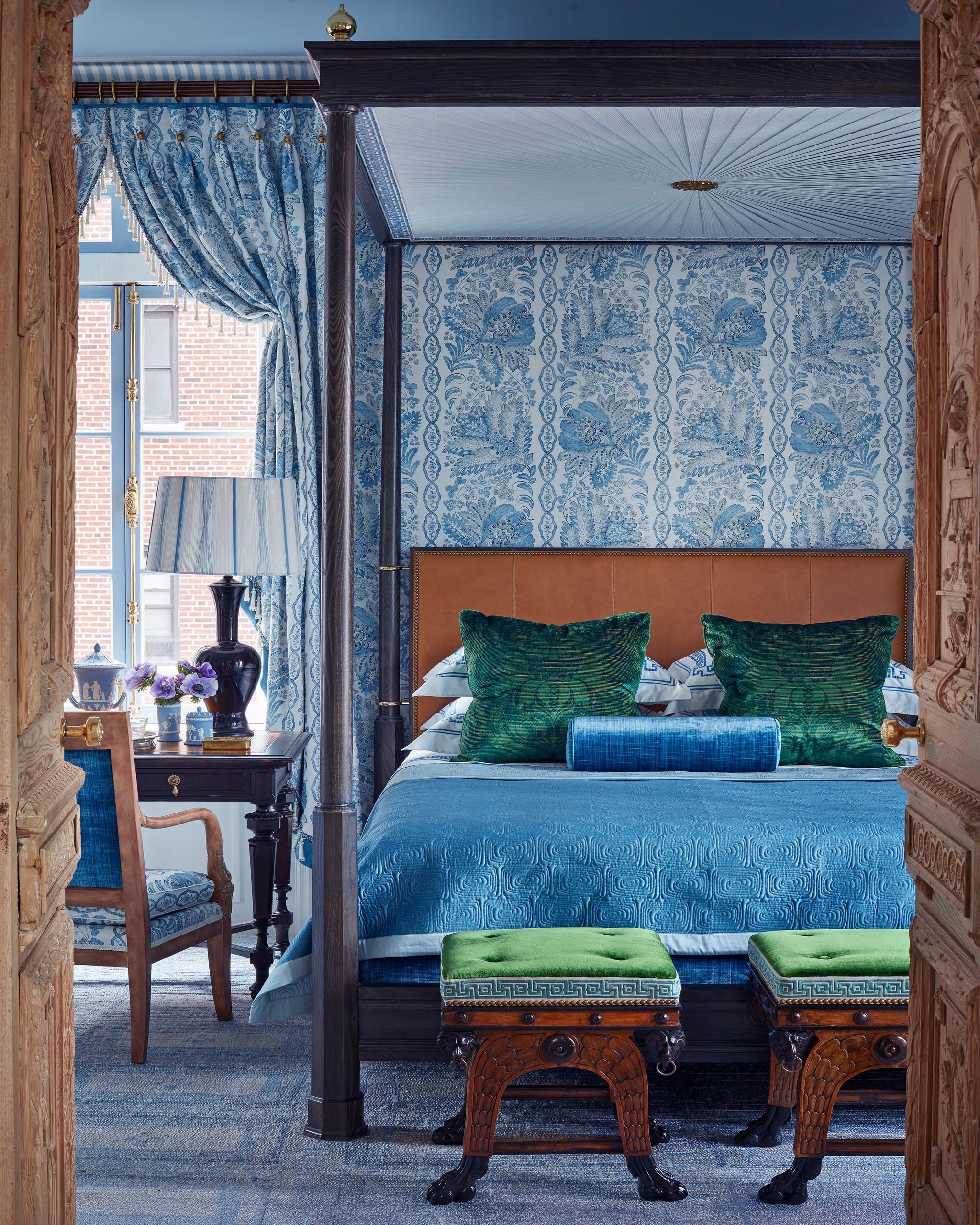 Marshall Watson New York Apartment Bedroom bedroom featuring a wood fourposter bed, blue bedroom, and blue and white wallpaper