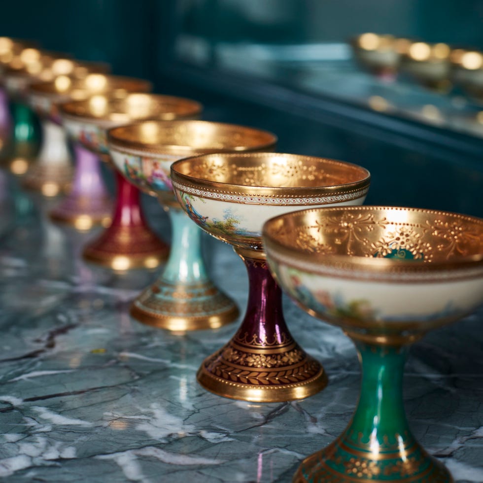 antique dessert cups lined up on a countertop