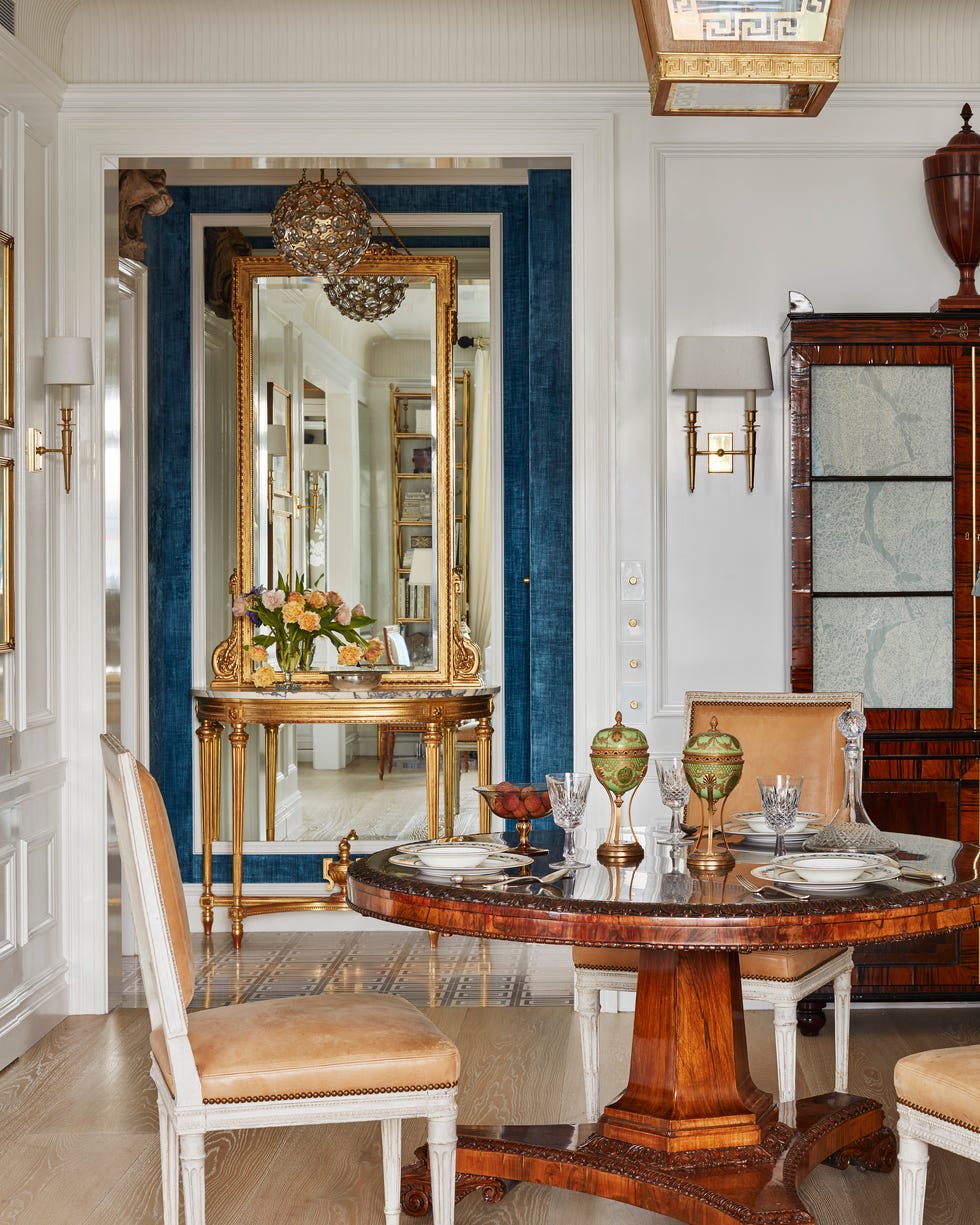 Marshall Watson New York Apartment Pedestal Table wood pedestal dining table with tan upholstered chairs around it