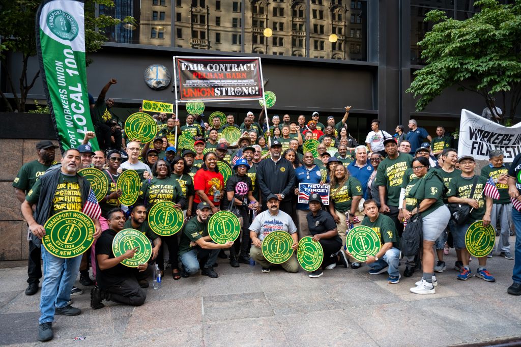 Members of the Transport Workers Union pose for a group photo at the Labor Day Rally and March in New York.