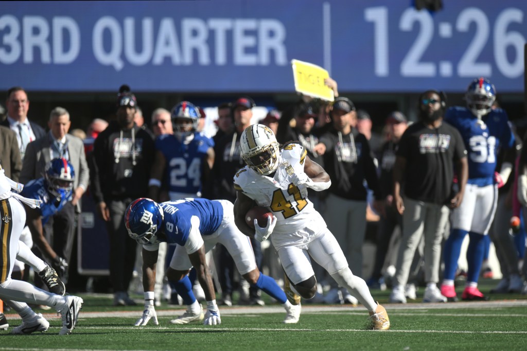 New Orleans Saints running back Alvin Kamara (41) runs after a catch for a 31-yard touchdown against the New York Giants during the third quarter at MetLife Stadium in East Rutherford, New Jersey, Sunday, Oct. 18, 2026.