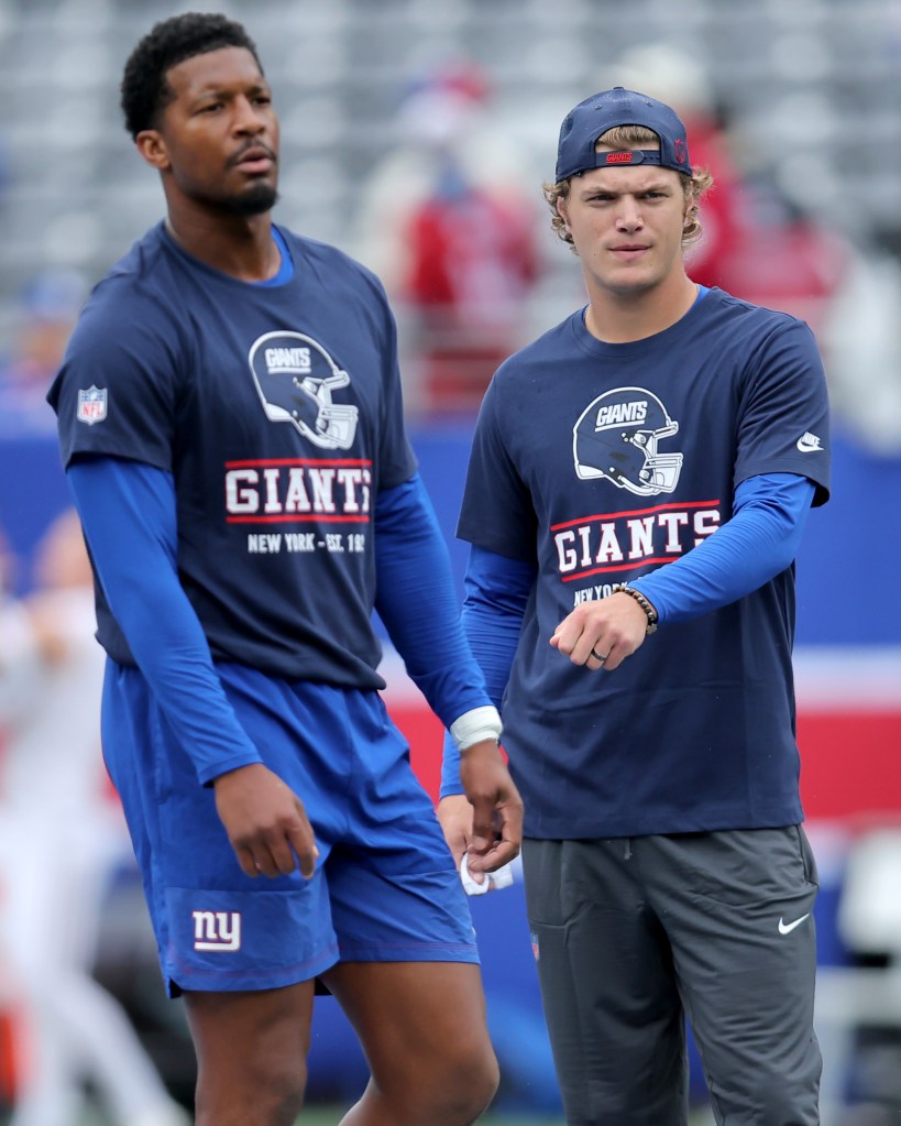 Giants quarterbacks Jameis Winston (l.) and J.J. McCarthy (r.) warm up before a game against the Arizona Cardinals at MetLife Stadium in East Rutherford, New Jersey, Sunday, Oct. 4, 2026.