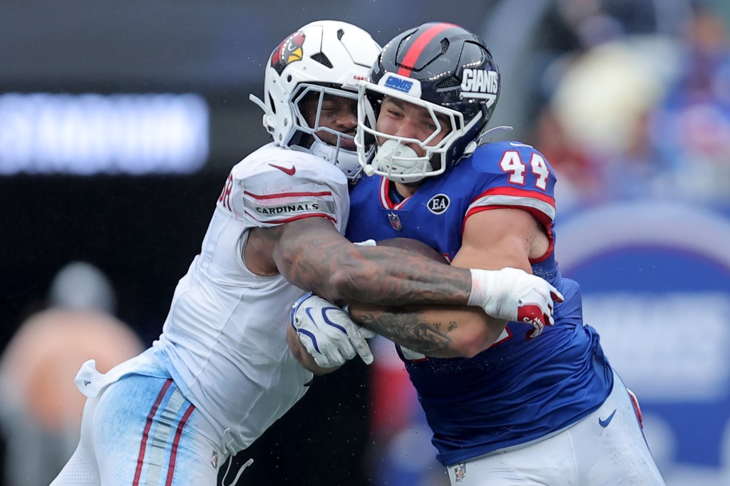 New York Giants running back Cam Skattebo (44) is tackled by Arizona Cardinals linebacker Mack Wilson Sr. (1) during a game.