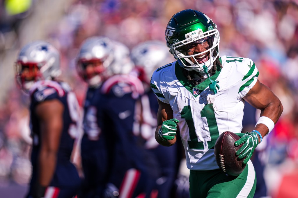 New York Jets wide receiver Omar Cooper Jr. celebrates after scoring against the New England Patriots.