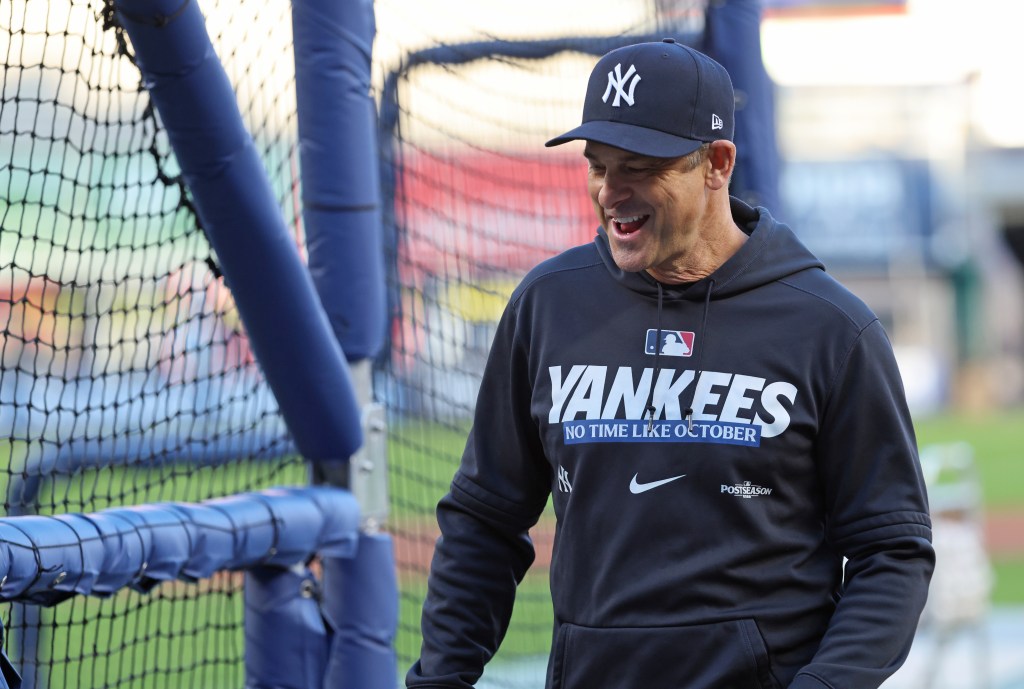New York Yankees manager Aaron Boone laughs on the field at Yankee Stadium.