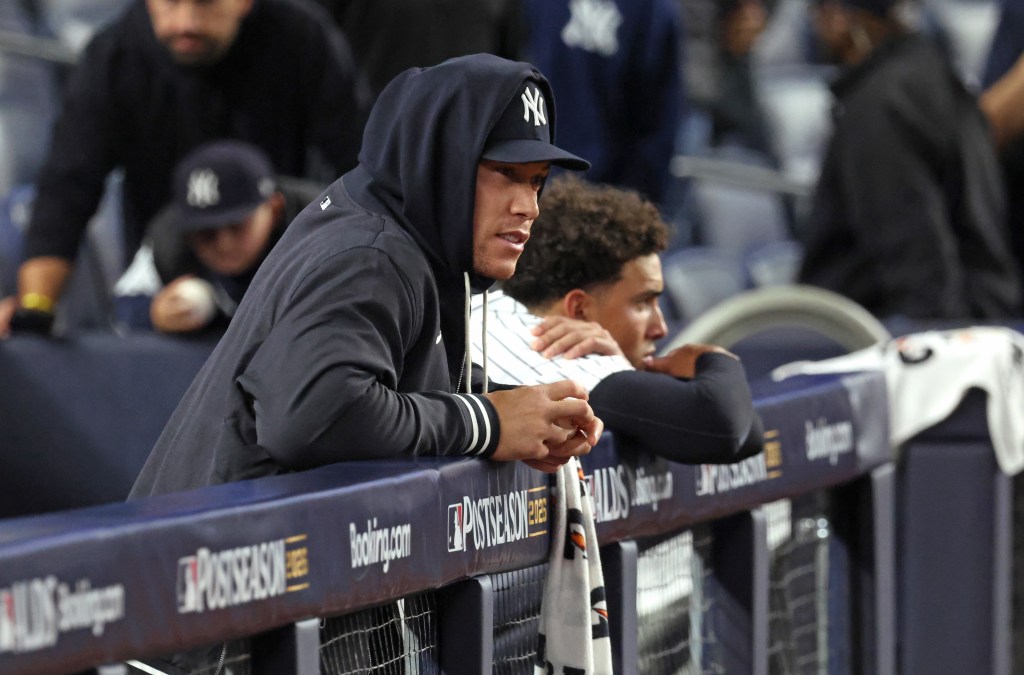 New York Yankees' Aaron Judge and shortstop George Lombard Jr. in the dugout.