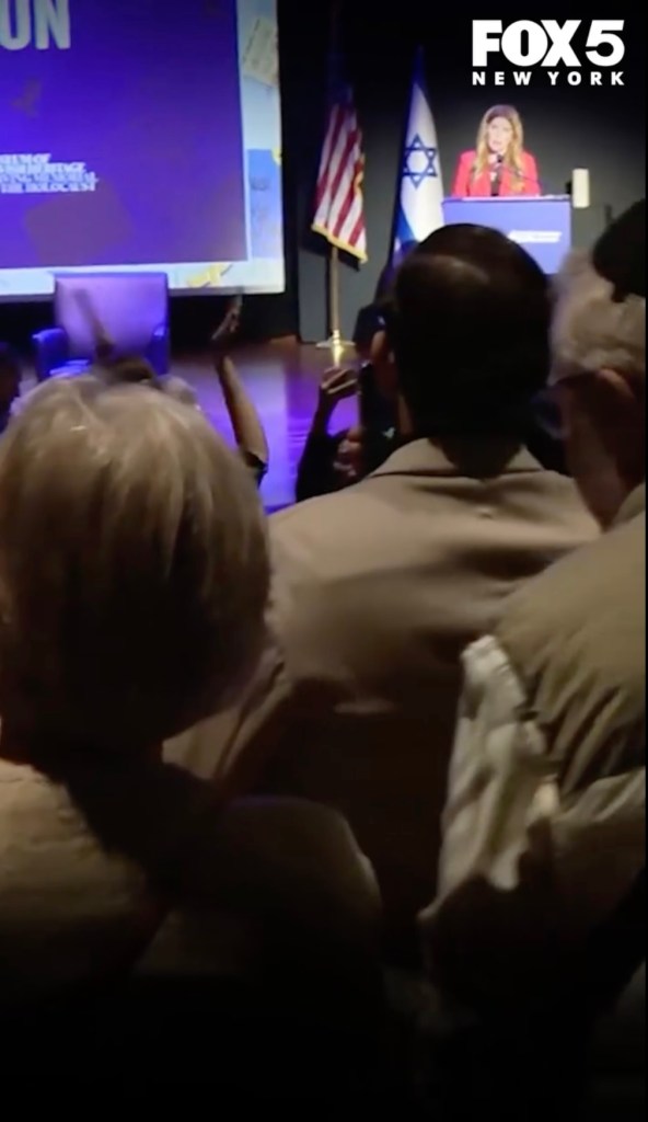 Audience members clap as NYC Council Speaker Menin delivers her speech marking the third anniversary of the Oct. 7 Hamas attack on Israel.