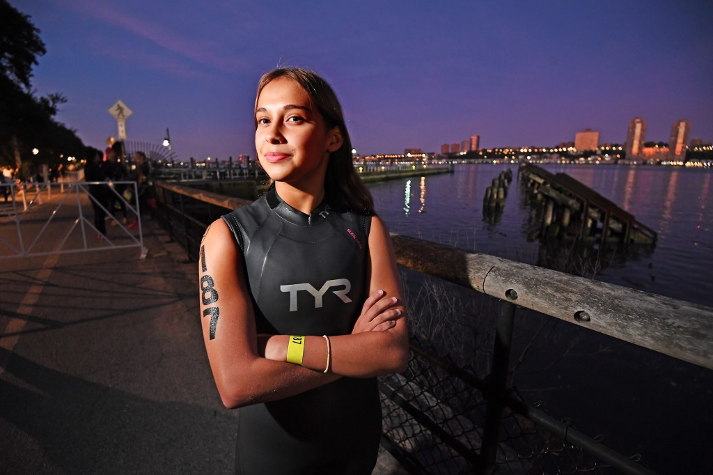 Illiana Blades, 14, of Brooklyn, prepares at the start line for the swim portion in the Hudson River as the NYC Triathlon returns.