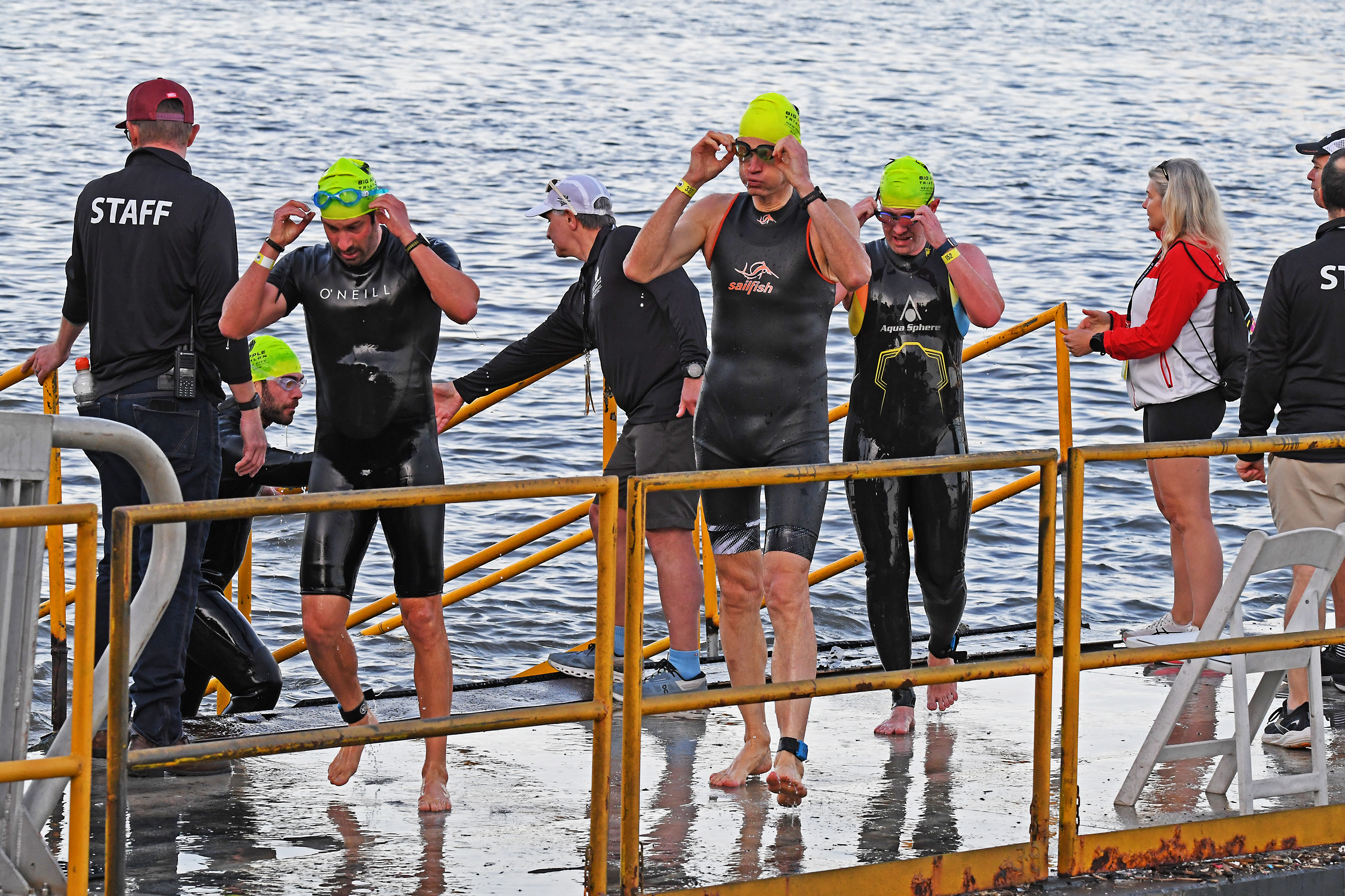 Triathletes exit the water after the swim portion of the NYC Triathlon.