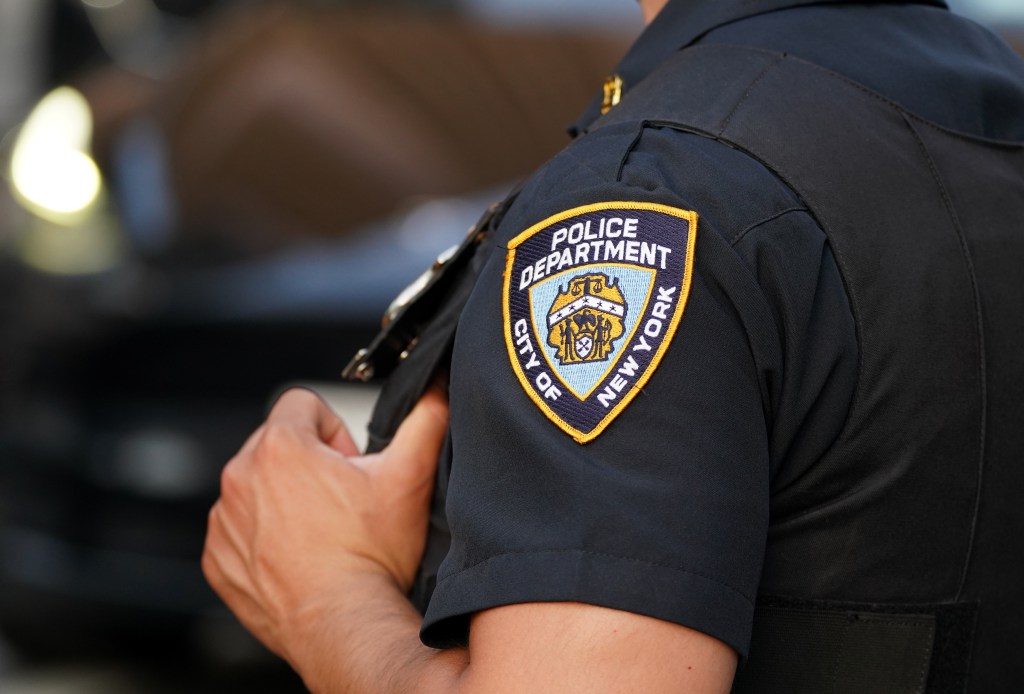 An NYPD arm patch on an officer's uniform.