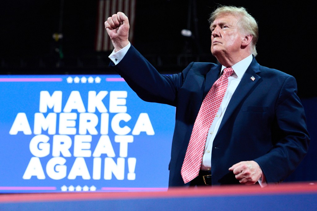 President Donald Trump gestures after speaking during a campaign rally at Heartland Credit Union Arena in Park City, Kan.