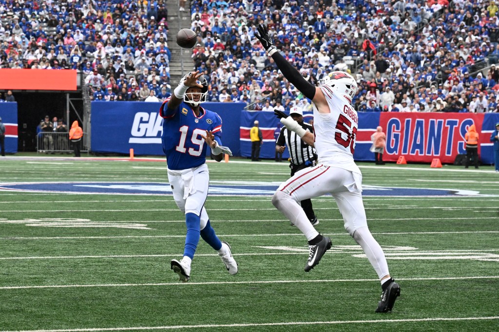 New York Giants quarterback Jameis Winston (19) throws a pass as Arizona Cardinals linebacker Jack Gibbens (50) pressures him during an NFL game.