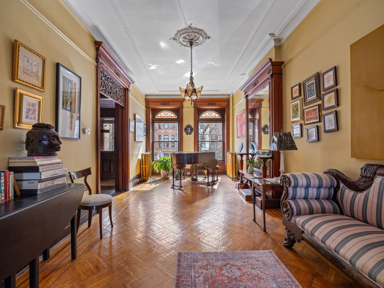 prospect heights parlor with pier mirror, fretwork, stained glass