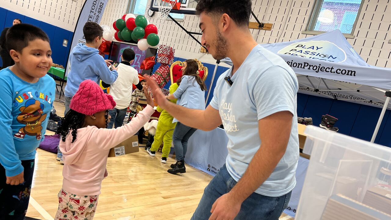 Rami is pictured with students at a large-scale shoe distribution event hosted by his non-profit Play Passion Project at PS 74, Tompkinsville, in December 2025.(Image: Jan Somma-Hammel) Rami is pictured with students at a large-scale shoe distribution event hosted by his non-profit Play Passion Project at PS 74, Tompkinsville, in December 2025.(Image: Jan Somma-Hammel)